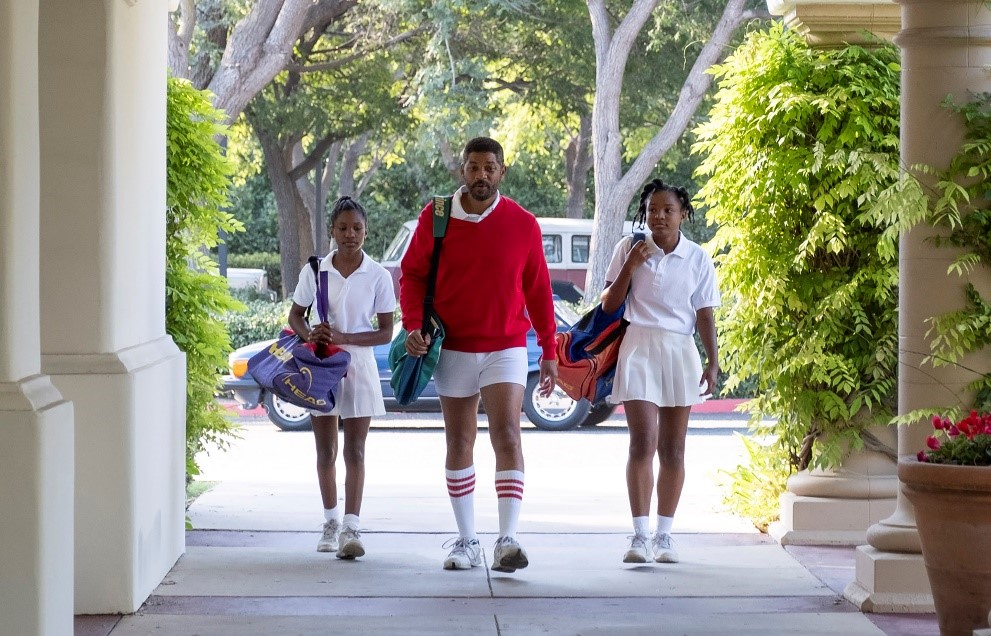 A group of people walking down a sidewalk
Description automatically generated with medium confidence