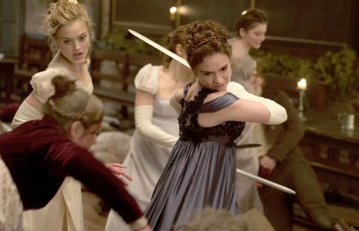 Lily James, wielding sword, as Elizabeth Bennet
