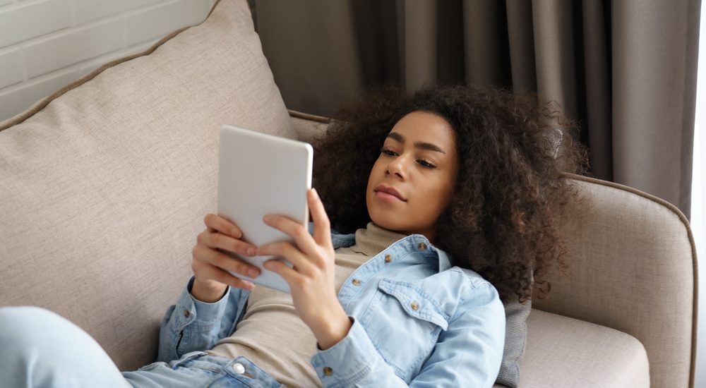 Photo of Woman Using Tablet